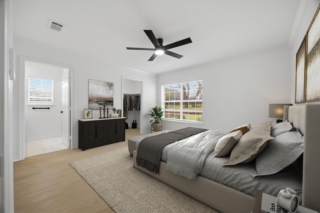 709 Sherman Street Rockwall, TX 75087 - Photo 5 of 23 a bedroom with a large bed and a window