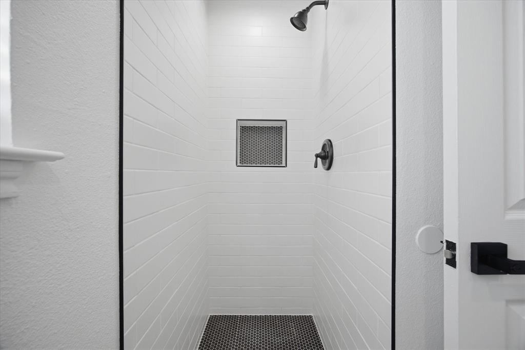 709 Sherman Street Rockwall, TX 75087 - Photo 7 of 23 a bathroom with a shower