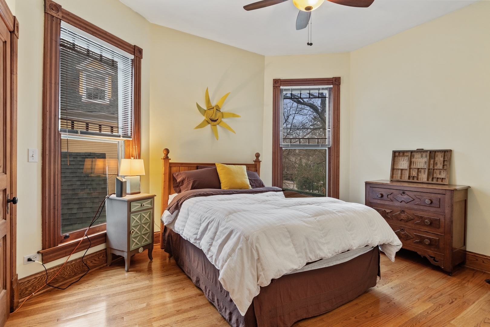 1333 Church Street Evanston, IL 60201 - Photo 23 of 32 a bedroom with a bed and a chandelier