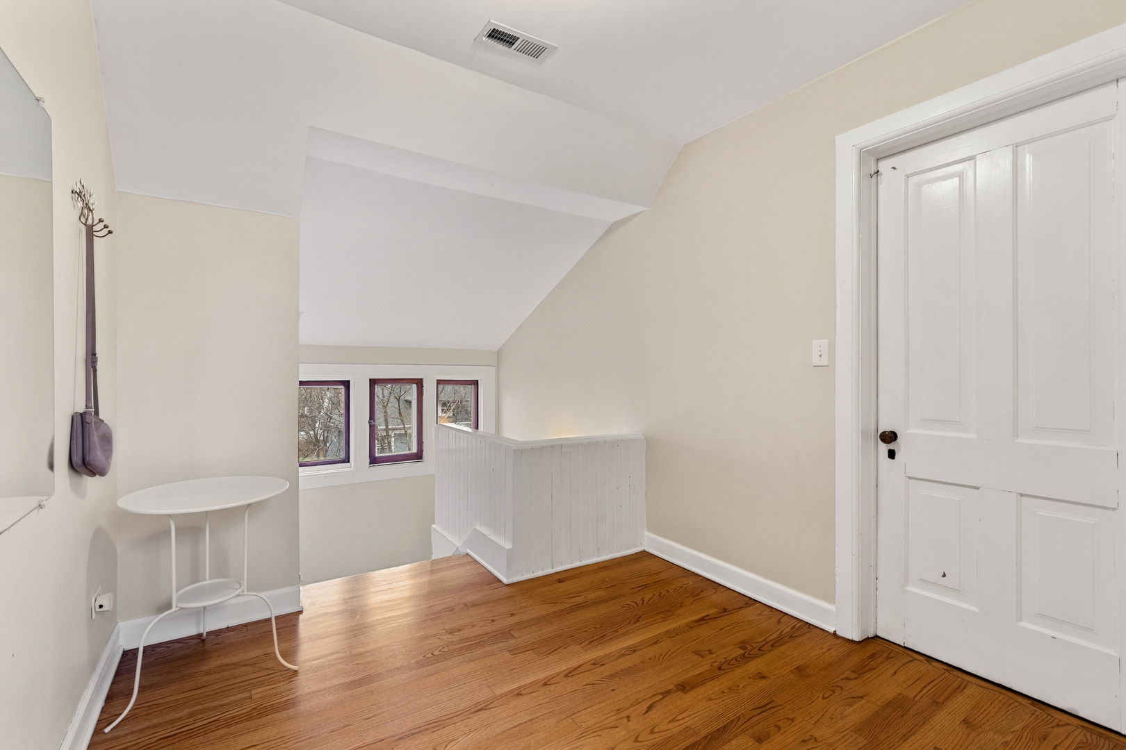 1333 Church Street Evanston, IL 60201 - Photo 27 of 32 a view of empty room with wooden floor and fan
