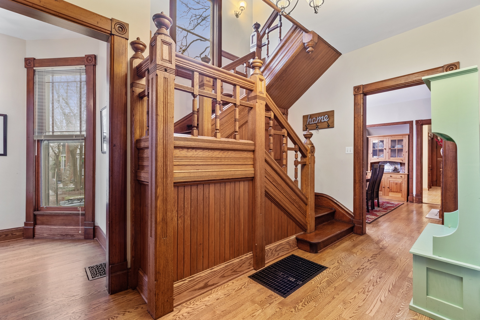1333 Church Street Evanston, IL 60201 - Photo 7 of 32 a view of an entryway with wooden floor and stairs