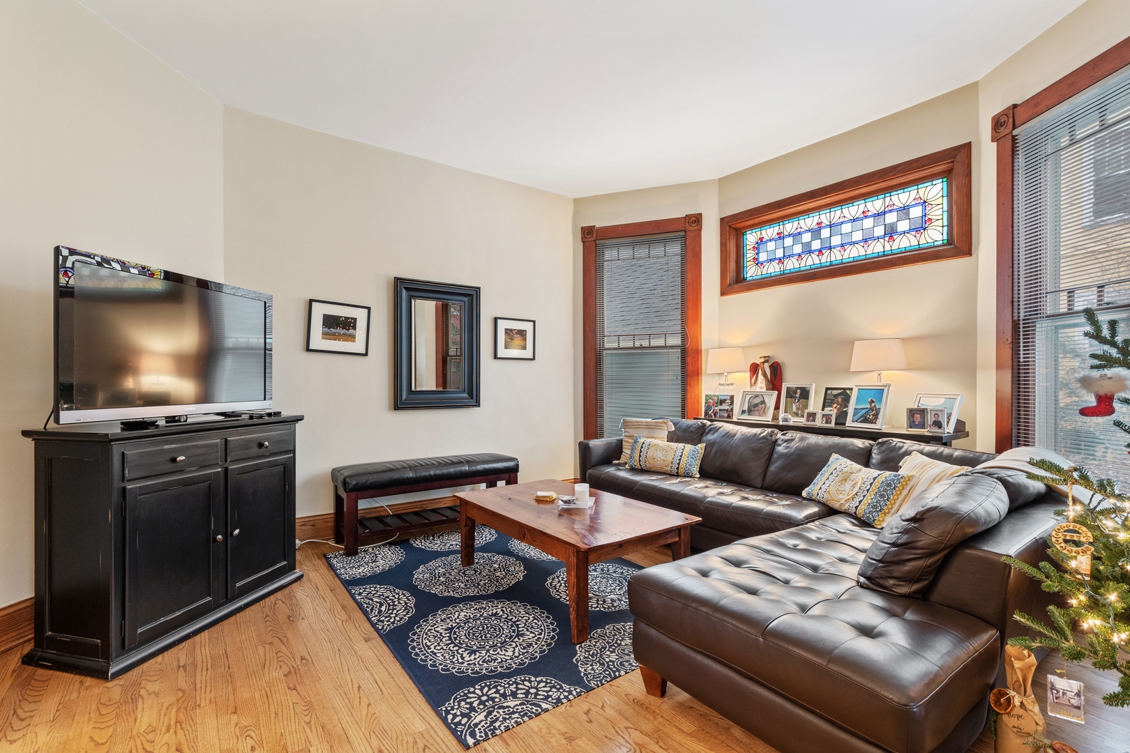 1333 Church Street Evanston, IL 60201 - Photo 10 of 32 a living room with furniture and a flat screen tv