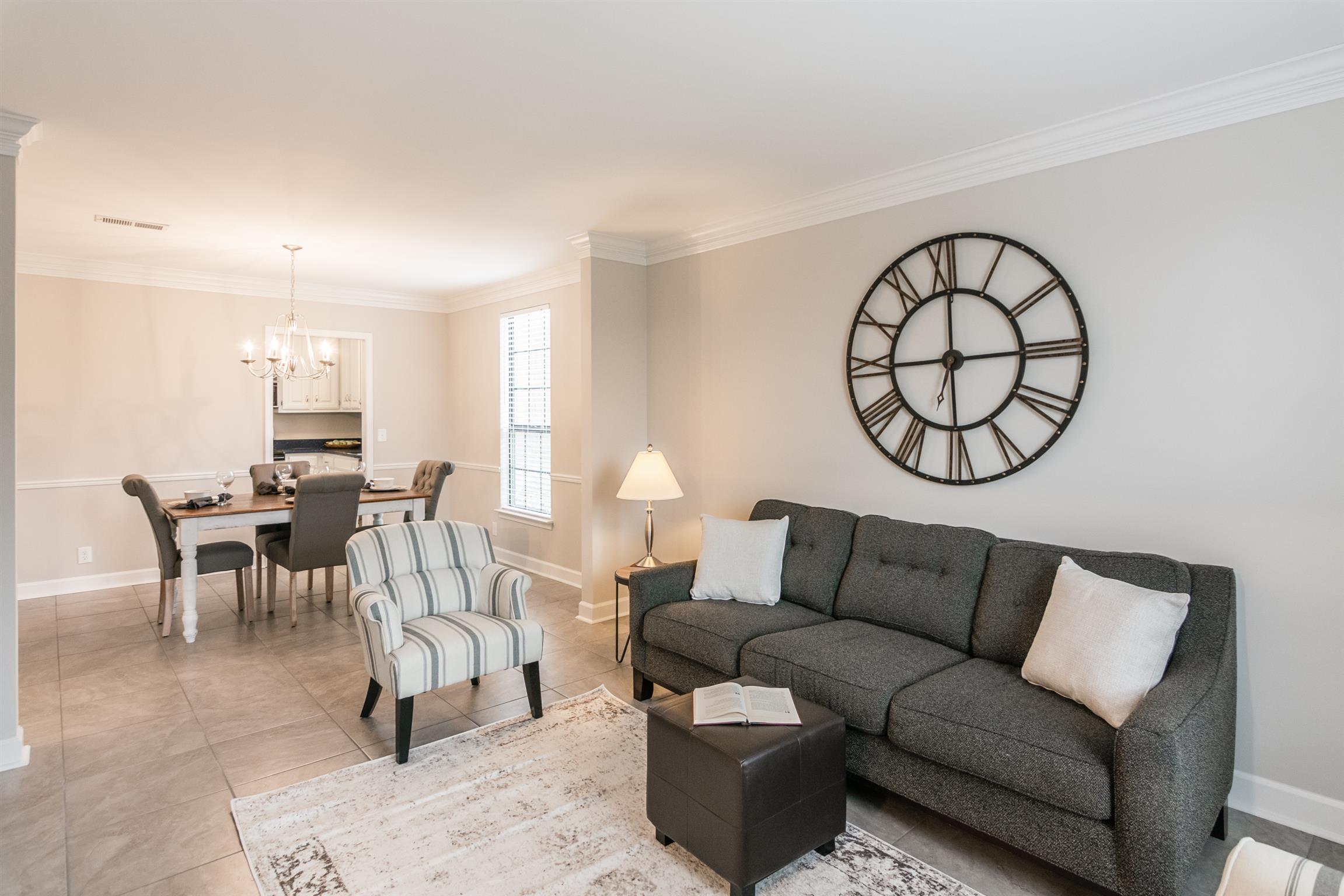 701 General George Patton Road Nashville, TN 37221 - Photo 2 of 27 a living room with furniture a clock and a rug