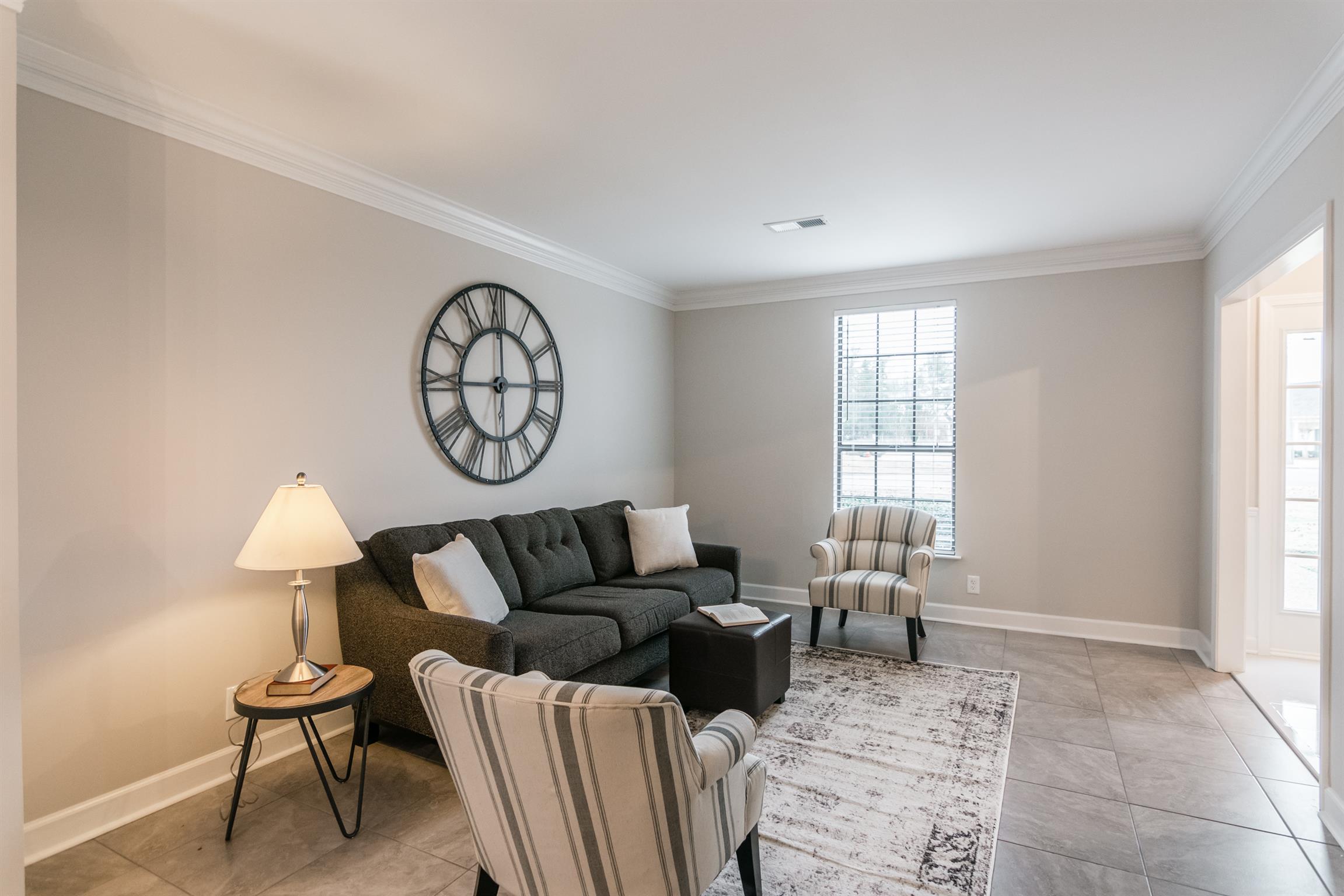701 General George Patton Road Nashville, TN 37221 - Photo 3 of 27 a living room with furniture a rug and a window