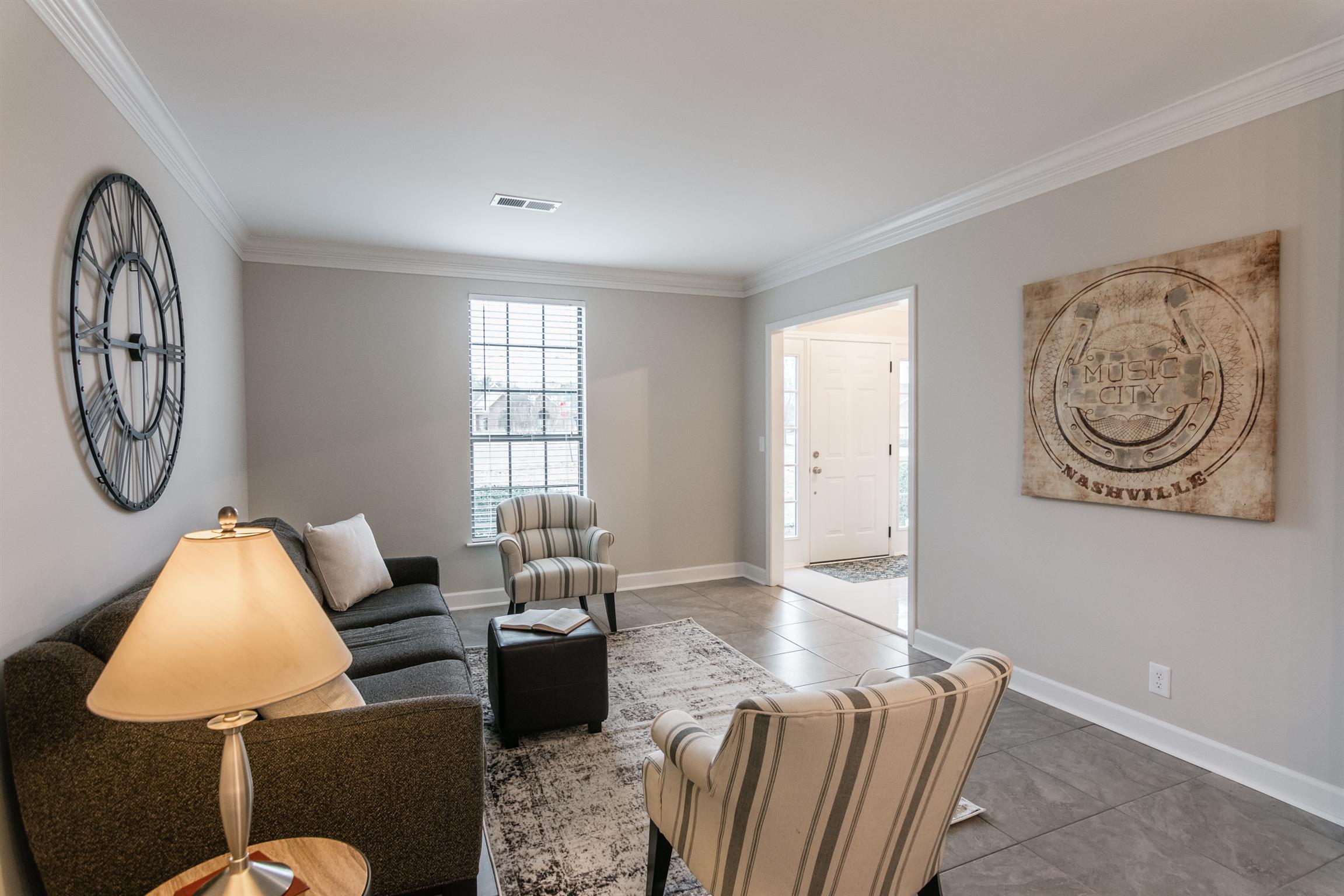 701 General George Patton Road Nashville, TN 37221 - Photo 4 of 27 a living room with furniture a rug and a window