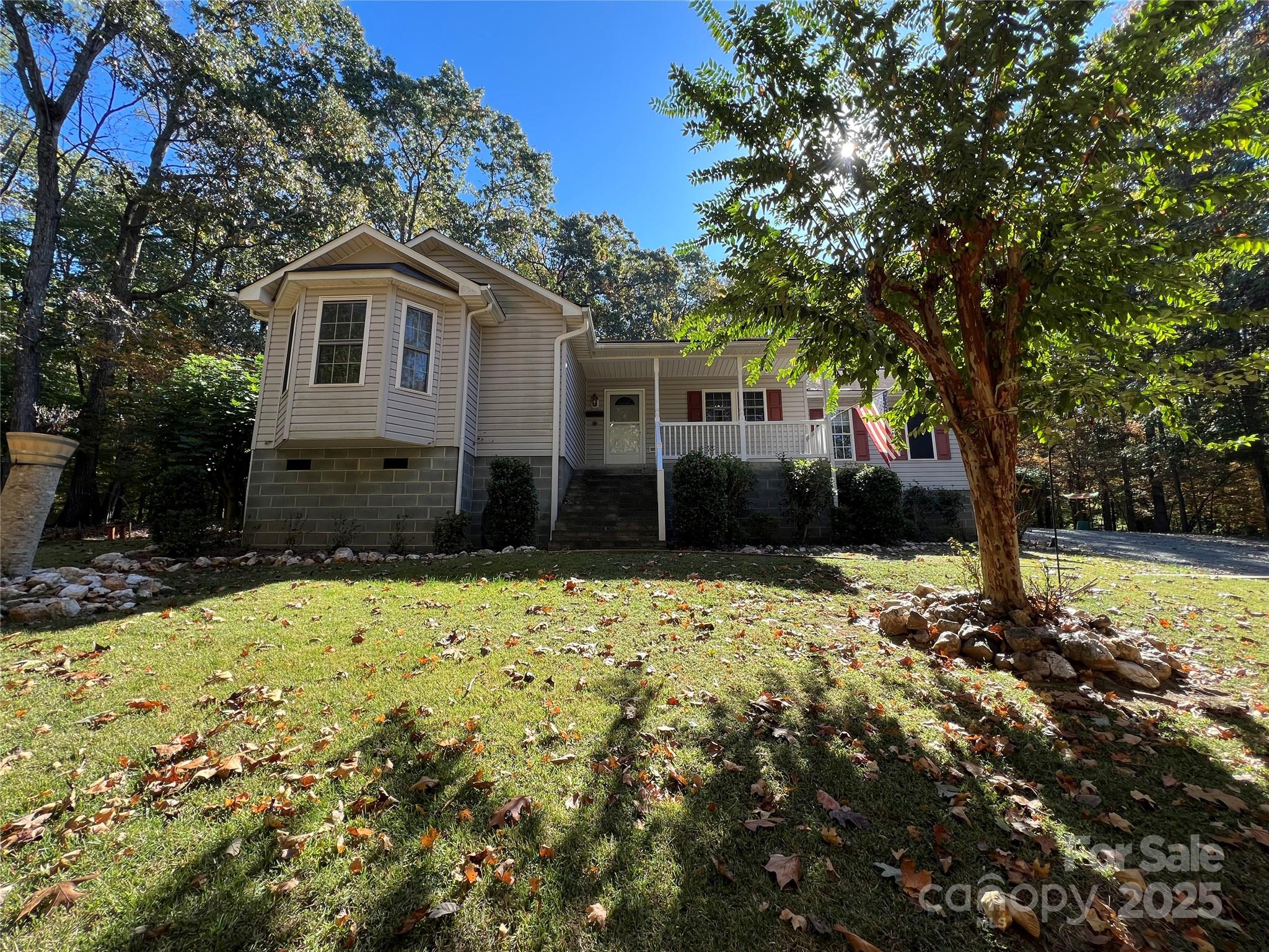 25397 Stony Mountain Road Albemarle, NC 28001 - Photo 2 of 32 a front view of a house with a yard covered with snow