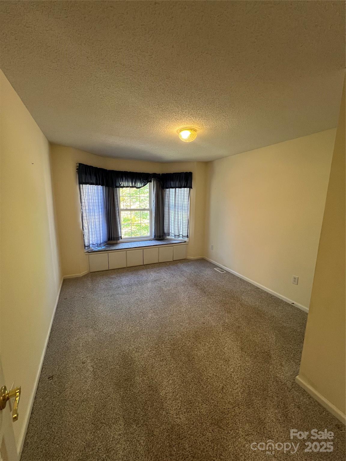 25397 Stony Mountain Road Albemarle, NC 28001 - Photo 24 of 32 an empty room with windows