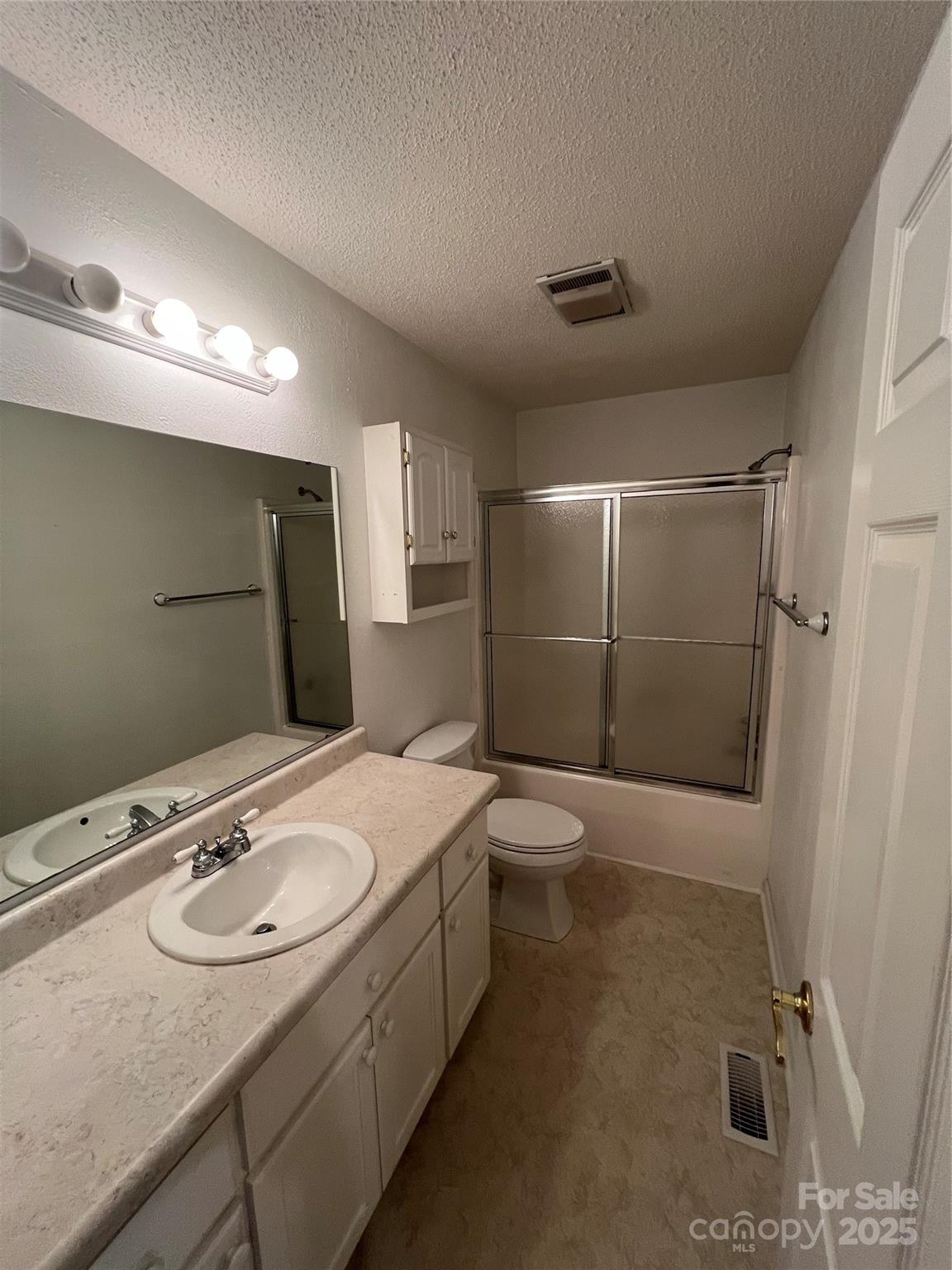 25397 Stony Mountain Road Albemarle, NC 28001 - Photo 26 of 32 a bathroom with a sink toilet and shower