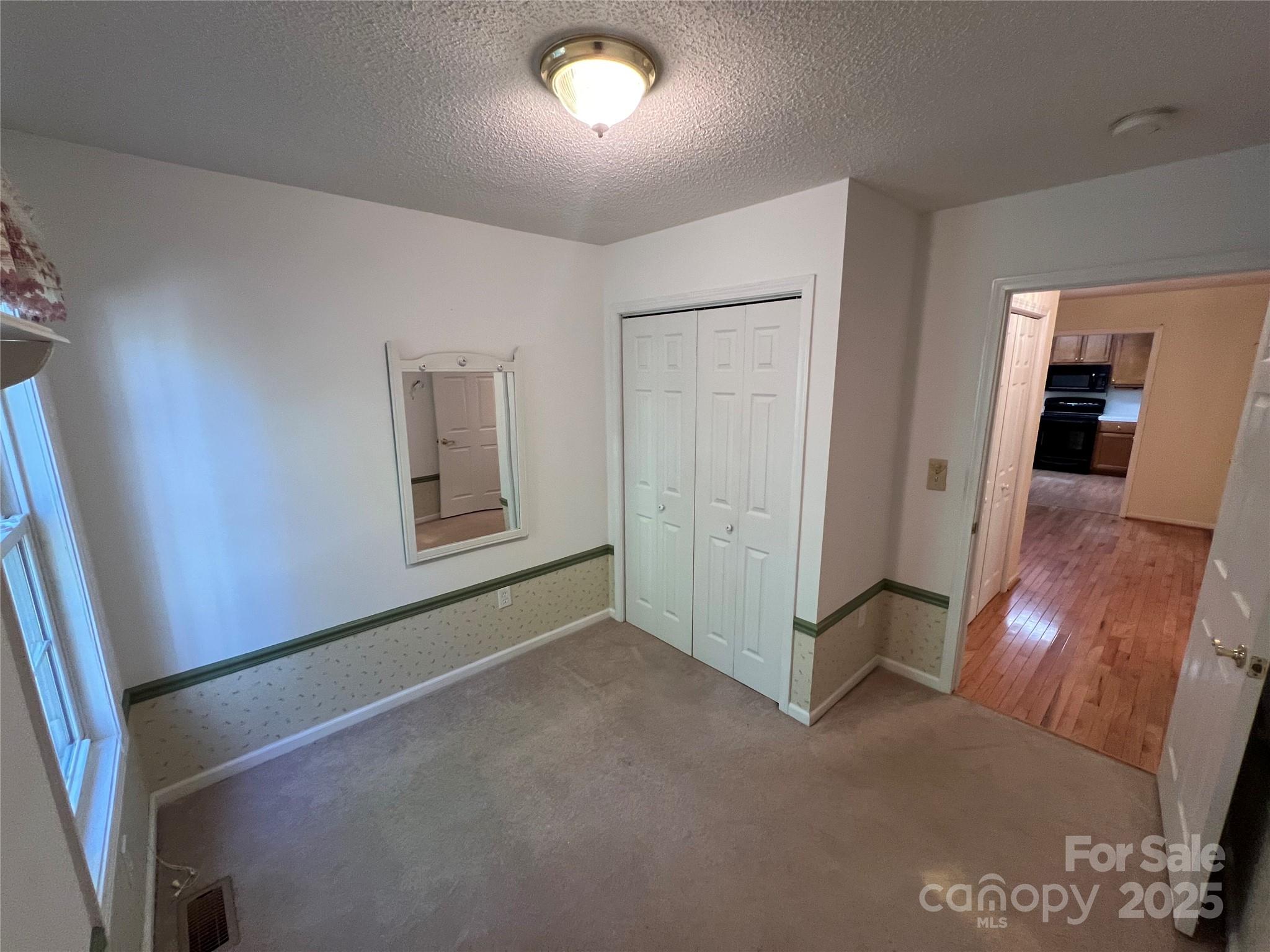 25397 Stony Mountain Road Albemarle, NC 28001 - Photo 28 of 32 a view of a room with wooden floor