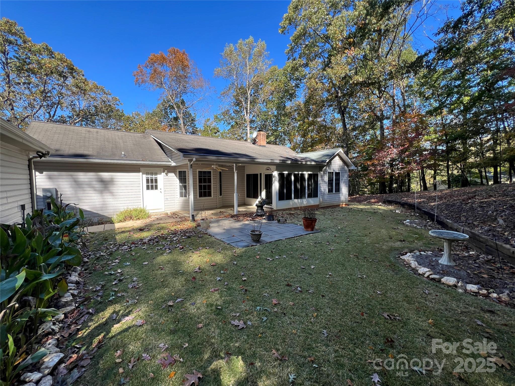 25397 Stony Mountain Road Albemarle, NC 28001 - Photo 30 of 32 a view of a house with backyard porch and sitting area