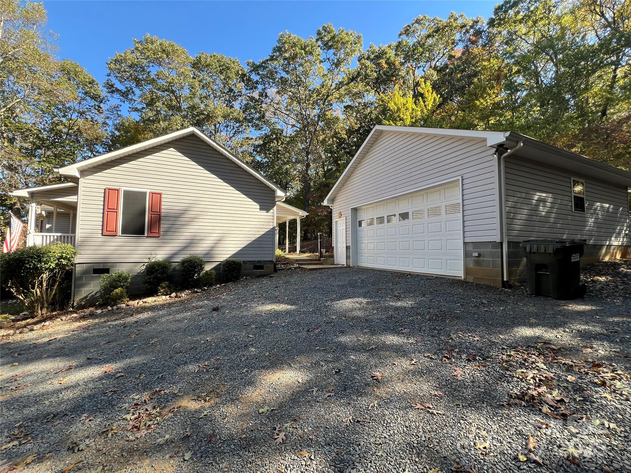 25397 Stony Mountain Road Albemarle, NC 28001 - Photo 32 of 32 a view of a house with a yard and garage