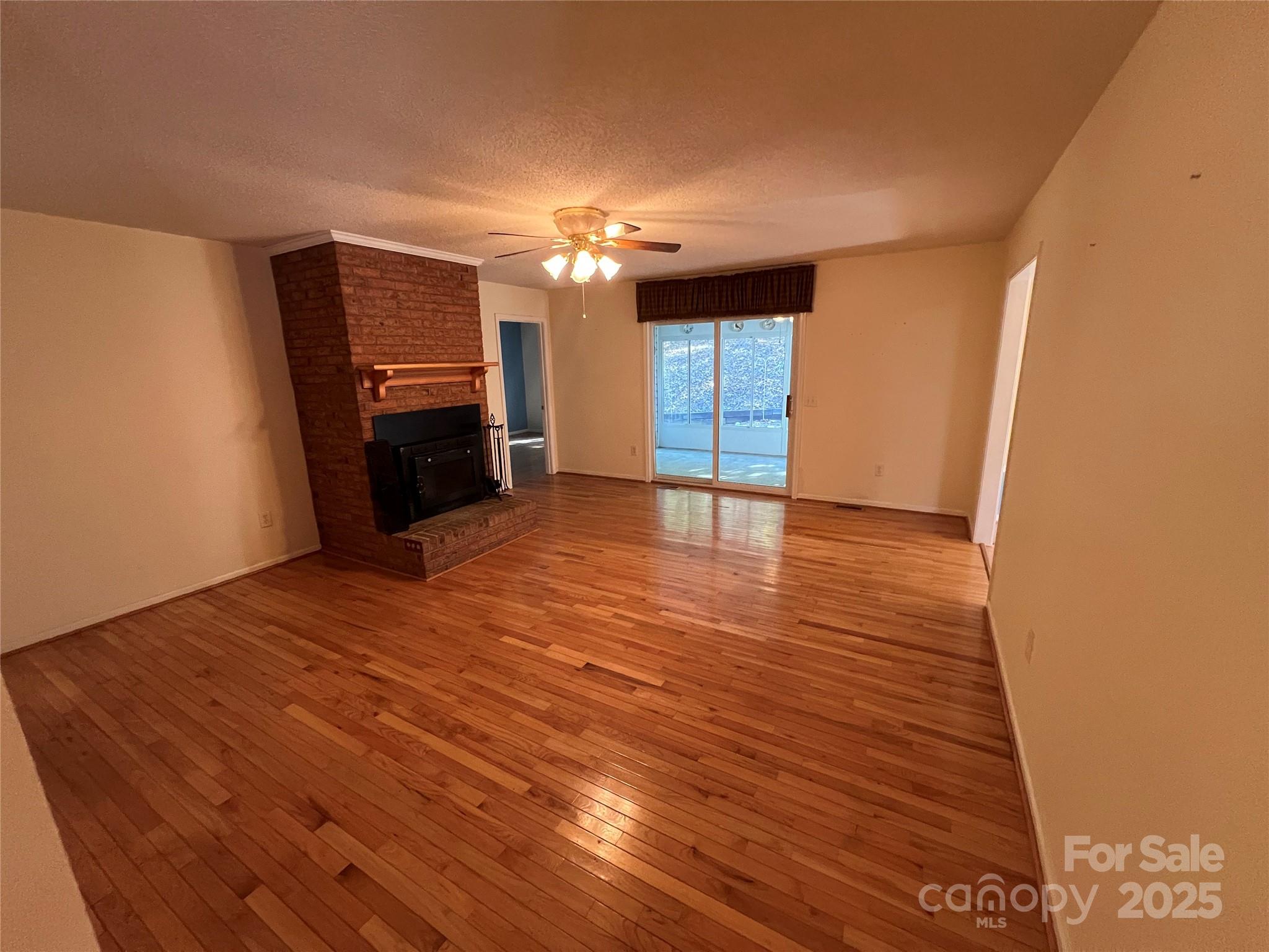 25397 Stony Mountain Road Albemarle, NC 28001 - Photo 7 of 32 a view of a livingroom with a flat screen tv