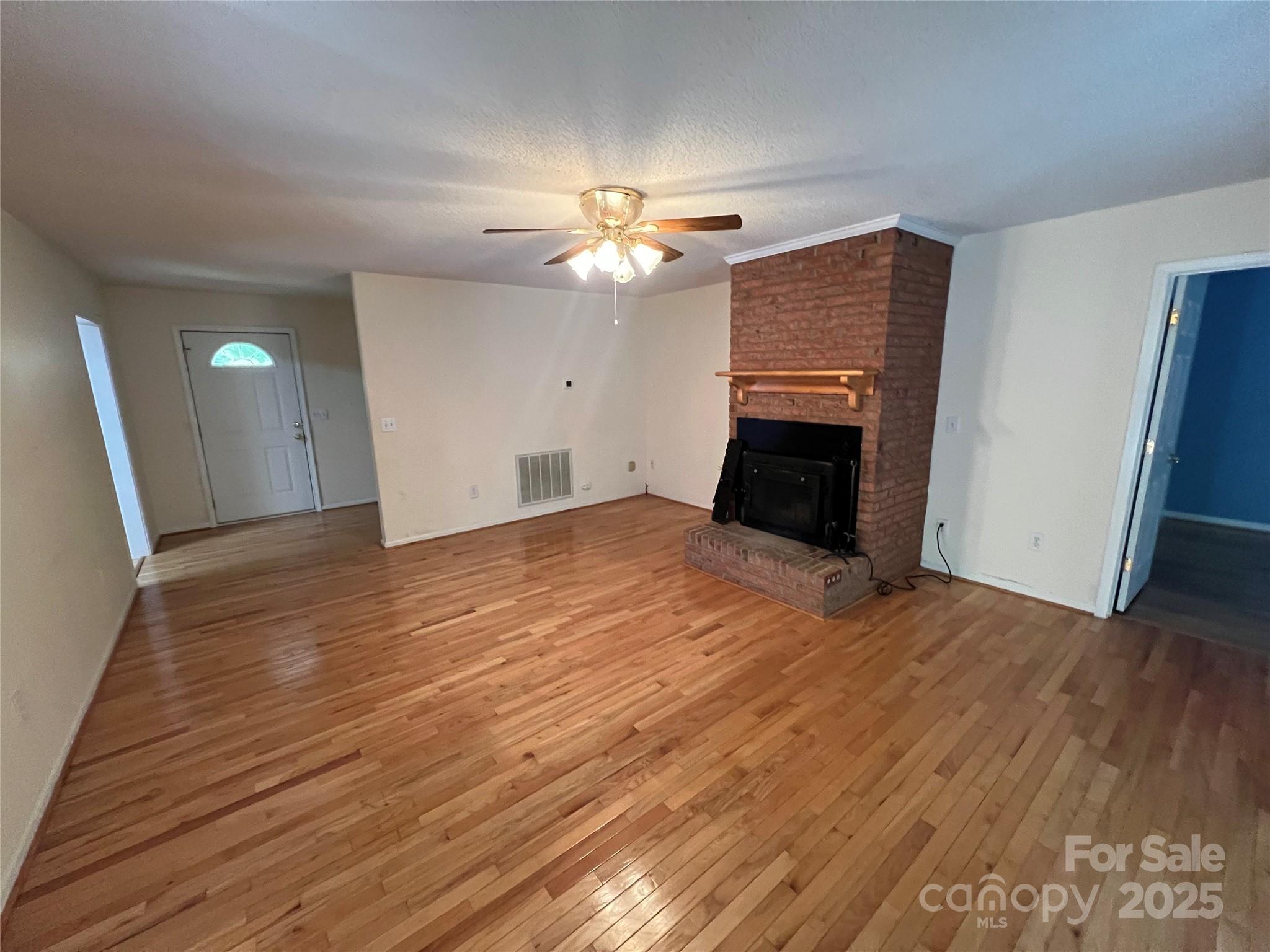 25397 Stony Mountain Road Albemarle, NC 28001 - Photo 8 of 32 a view of empty room with wooden floor