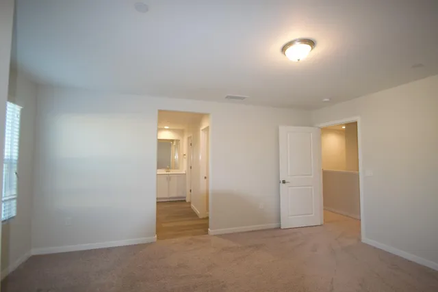 an empty room with a bathroom