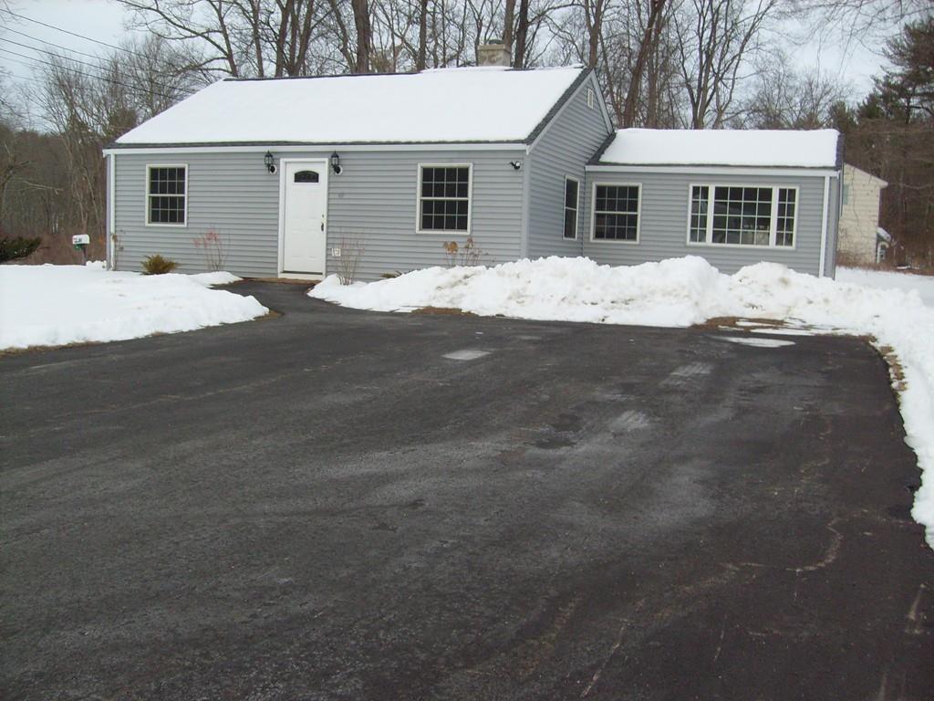 49 Birch Meadow Road Merrimac, MA 01860 - Photo 1 of 27 a front view of a house with a yard covered in snow