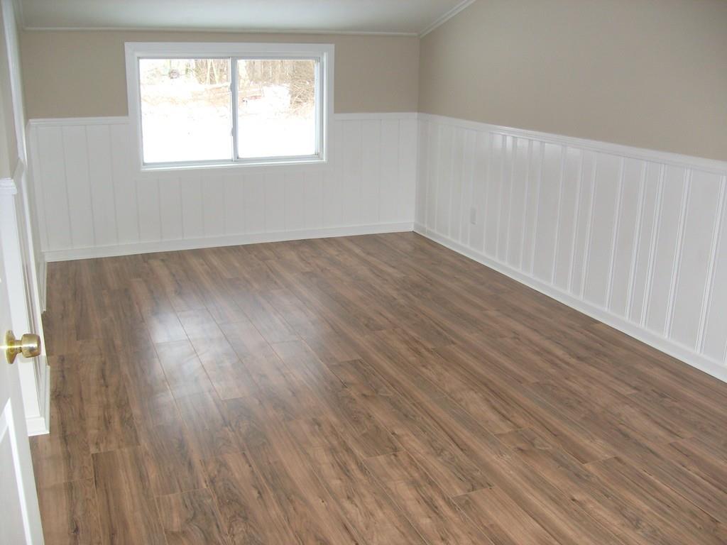 49 Birch Meadow Road Merrimac, MA 01860 - Photo 12 of 27 an empty room with wooden floor and windows