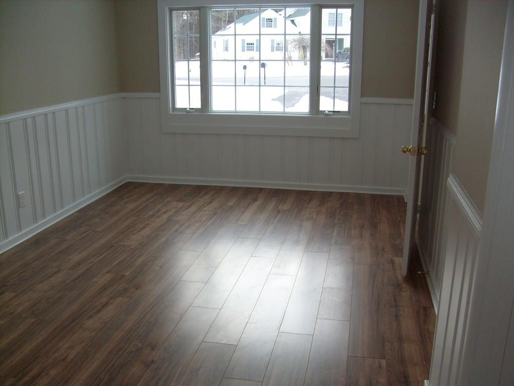 49 Birch Meadow Road Merrimac, MA 01860 - Photo 13 of 27 an empty room with wooden floor and windows