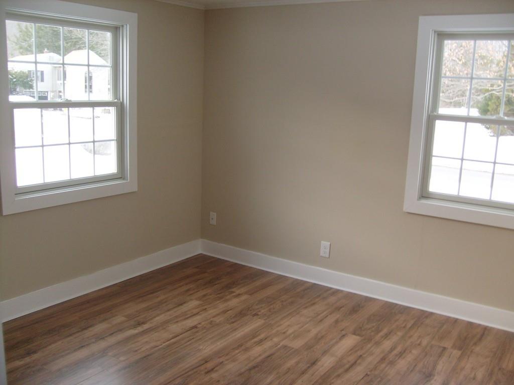 49 Birch Meadow Road Merrimac, MA 01860 - Photo 21 of 27 an empty room with wooden floor and windows