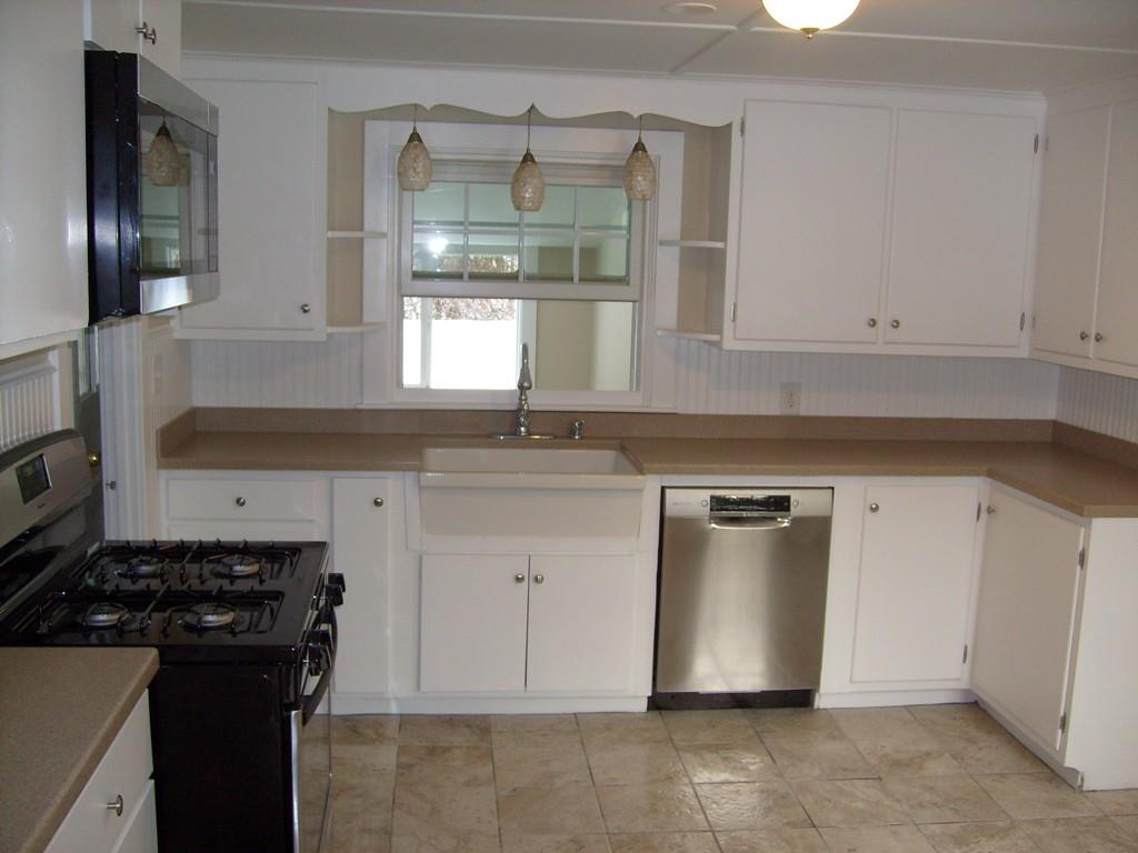 49 Birch Meadow Road Merrimac, MA 01860 - Photo 5 of 27 a kitchen with stainless steel appliances granite countertop a sink stove and cabinets