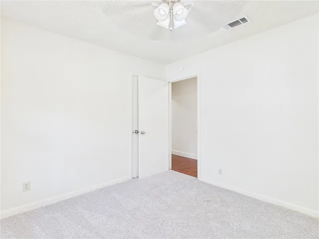 a bathroom with a tub and toilet