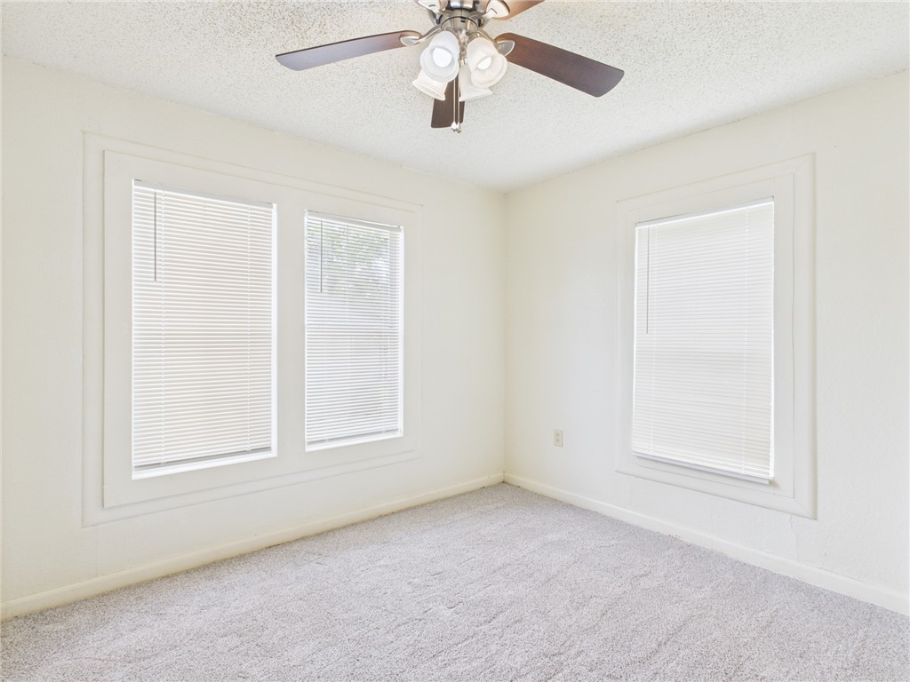2702 Cavitt Avenue Bryan, TX 77801 - Photo 18 of 21 Carpeted spare room with a textured ceiling