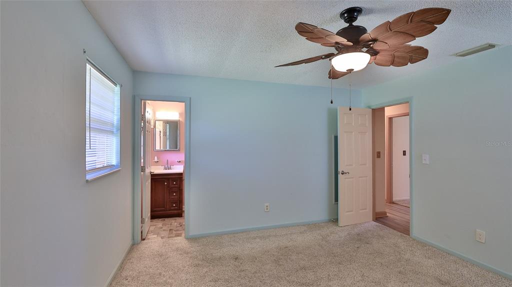 725 Green Road New Smyrna Beach, FL 32168 - Photo 12 of 40 wooden floor in an empty room with a window