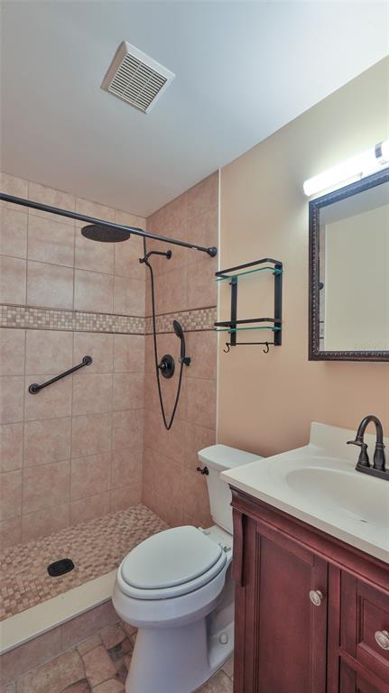 725 Green Road New Smyrna Beach, FL 32168 - Photo 14 of 40 a bathroom with a sink toilet and shower