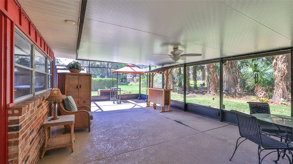 725 Green Road New Smyrna Beach, FL 32168 - Photo 30 of 40 a view of a porch with furniture and a porch