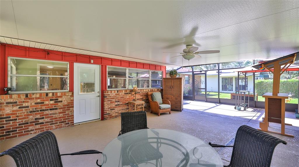 725 Green Road New Smyrna Beach, FL 32168 - Photo 31 of 40 a bedroom with furniture and large windows