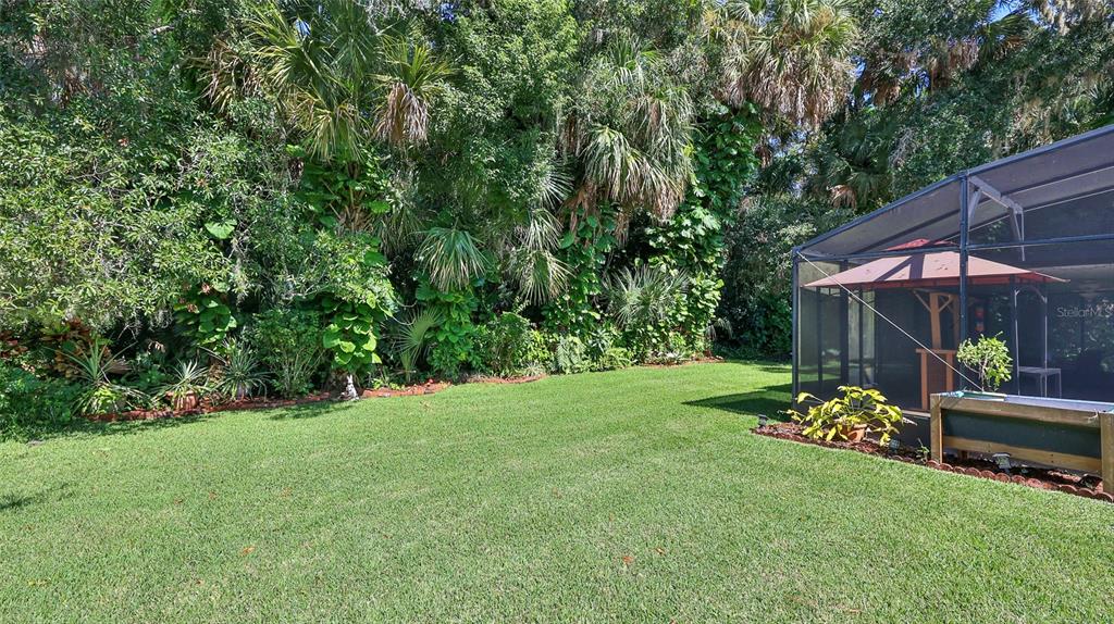725 Green Road New Smyrna Beach, FL 32168 - Photo 37 of 40 a backyard of a house with lots of green space