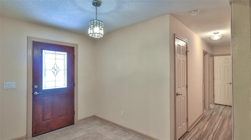 725 Green Road New Smyrna Beach, FL 32168 - Photo 6 of 40 a view of an entryway with wooden floor