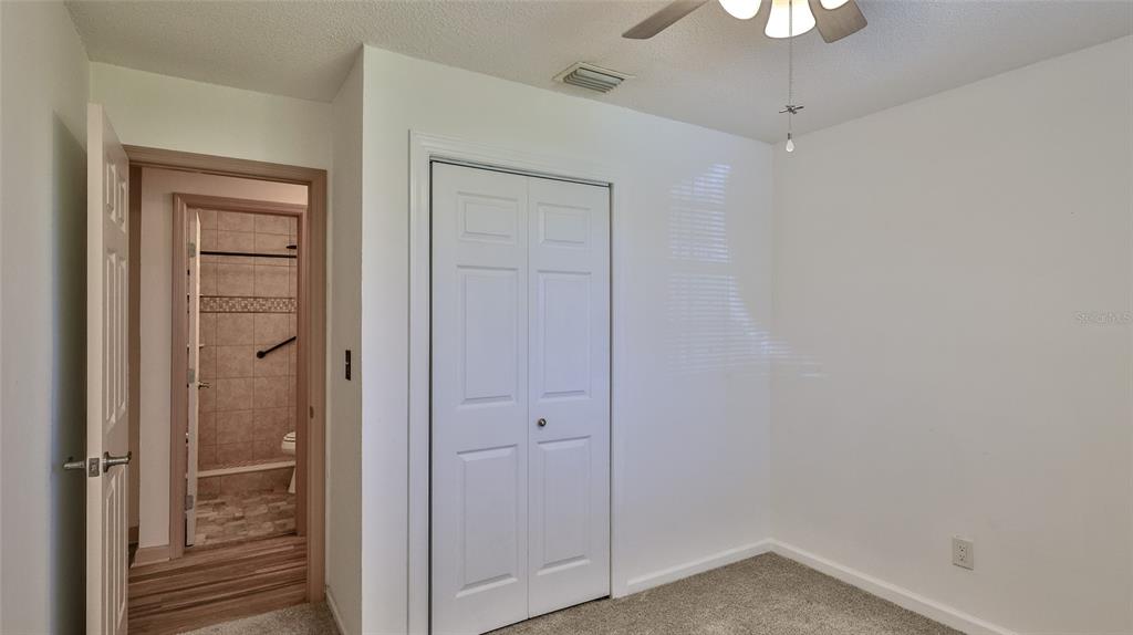 725 Green Road New Smyrna Beach, FL 32168 - Photo 7 of 40 a view of a hallway with a wooden door
