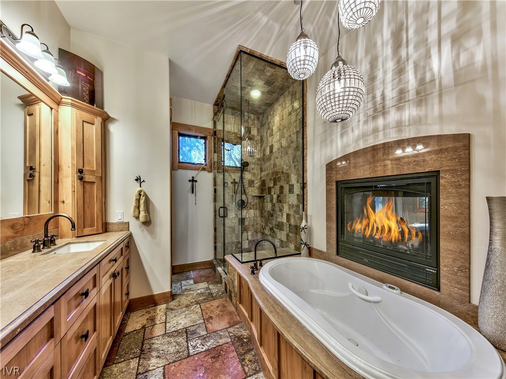 121 Mayhew Circle Incline Village, NV 89451 - Photo 28 of 34 a spacious bathroom with a sink a bathtub and a shower