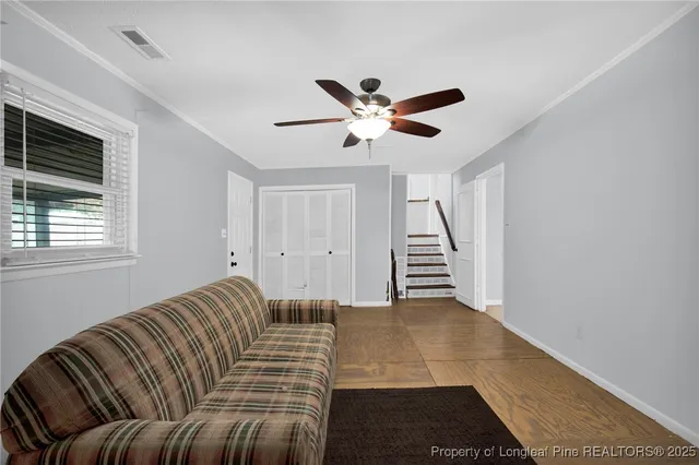 a living room with furniture and a window