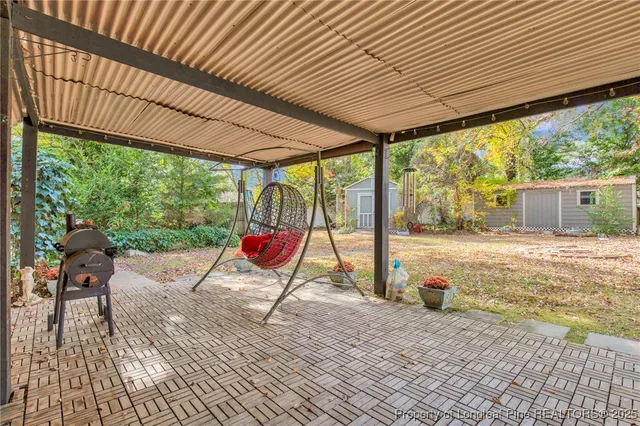 a view of porch with wooden floor