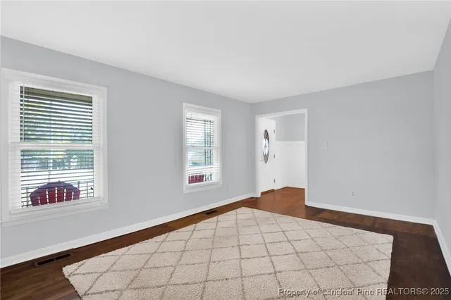 a view of an empty room and window