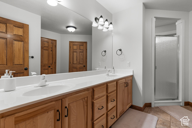 1340 Trapper Loop Garden City, UT 84028 - Photo 18 of 35 Full bathroom featuring double vanity and a stall shower