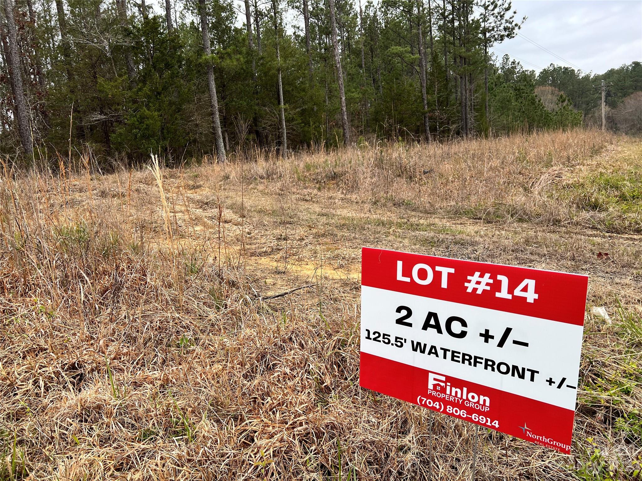 Lot #14 Mountain Lakes Road Chester, SC 29706 - Photo 10 of 13 a sign that is sitting on a field