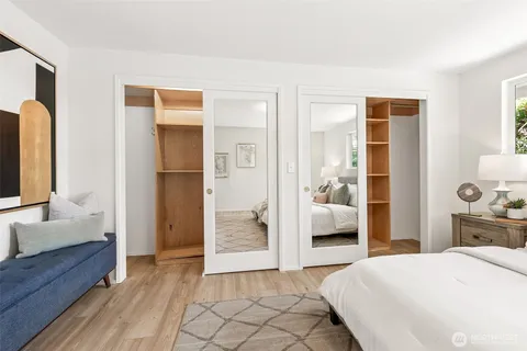a bedroom with a bed and a couch