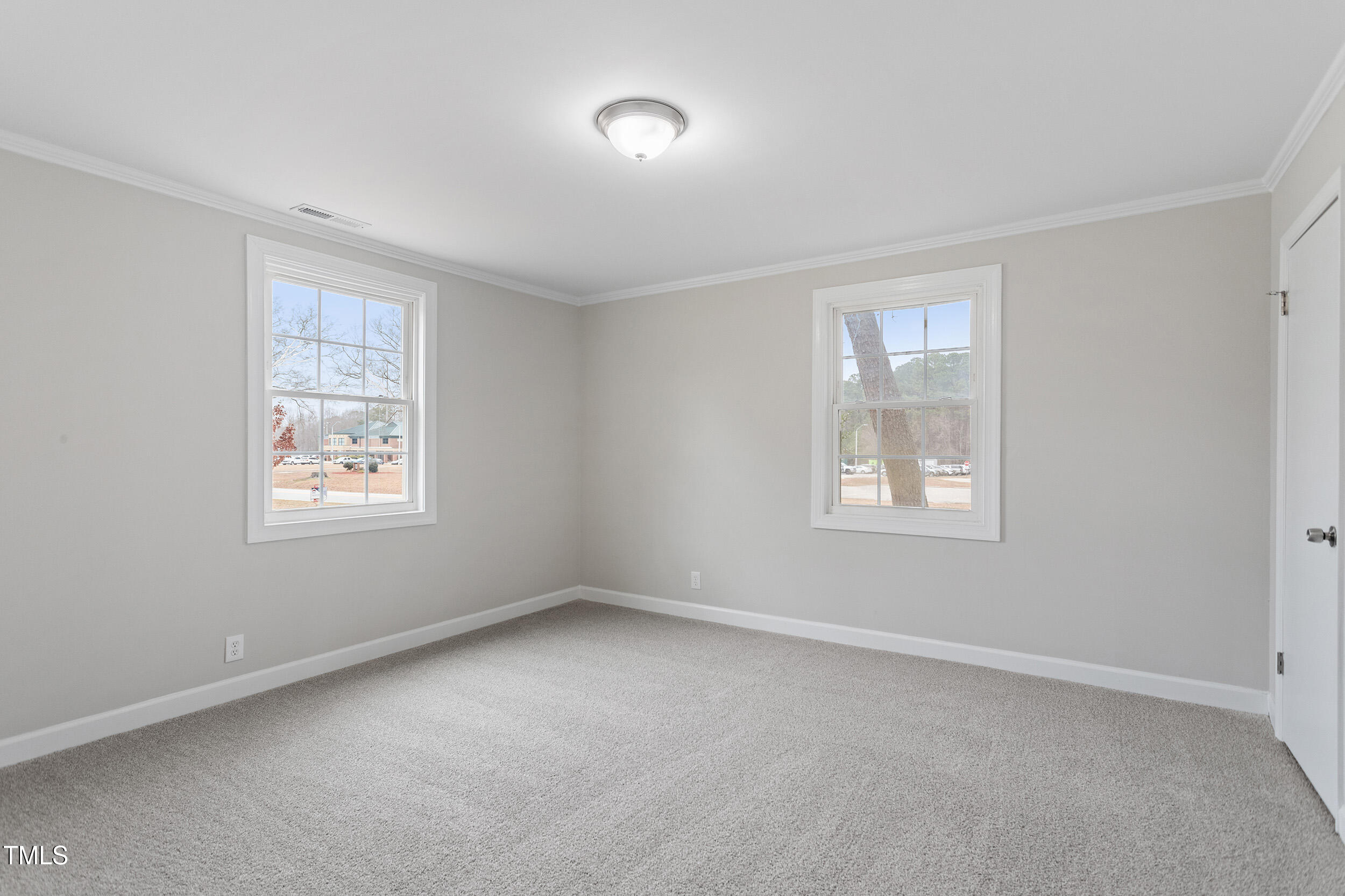6215 Pine Street Bailey, NC 27807 - Photo 11 of 24 an empty room with windows