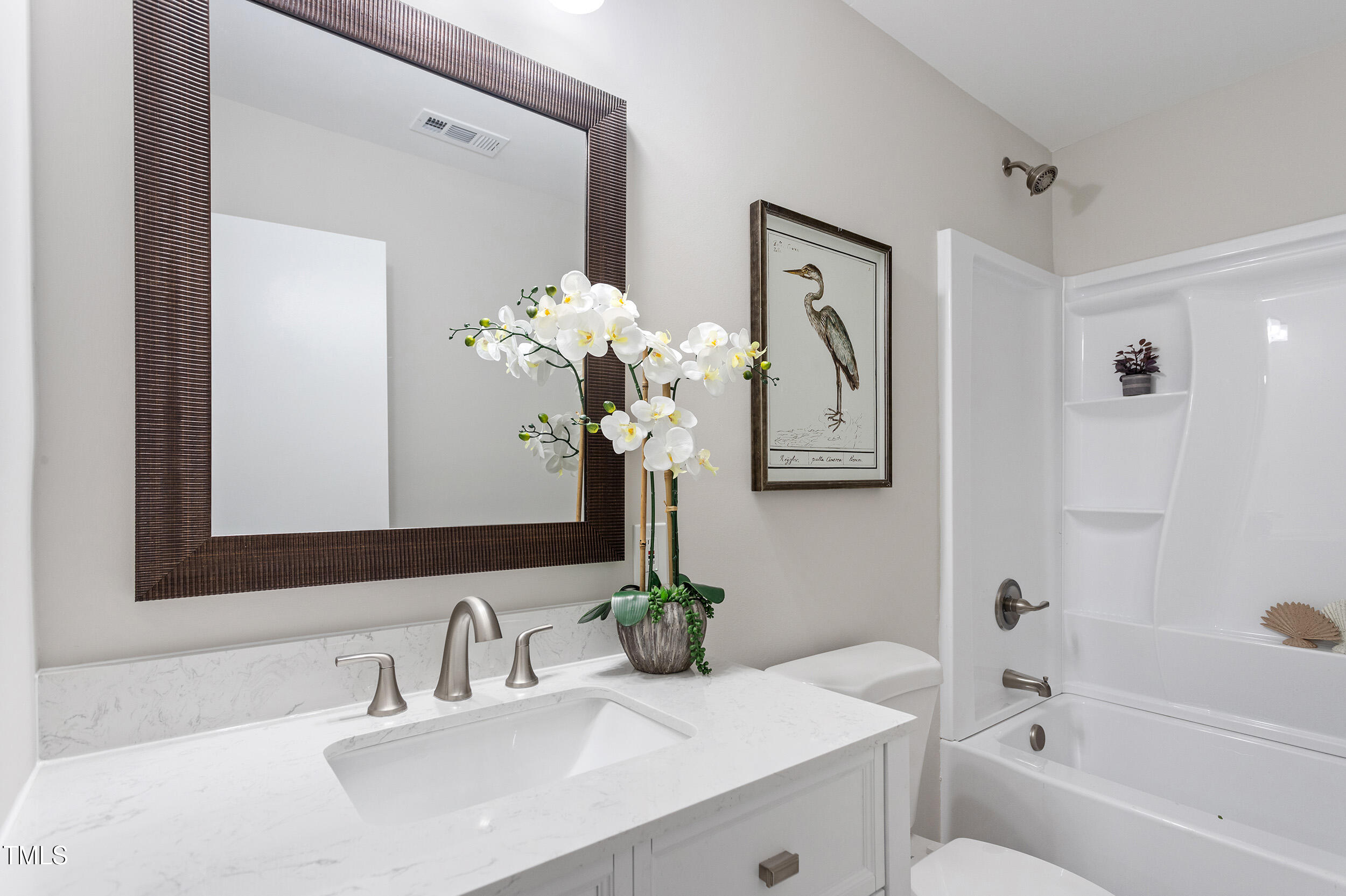 6215 Pine Street Bailey, NC 27807 - Photo 13 of 24 a bathroom with a sink a toilet and a bathtub