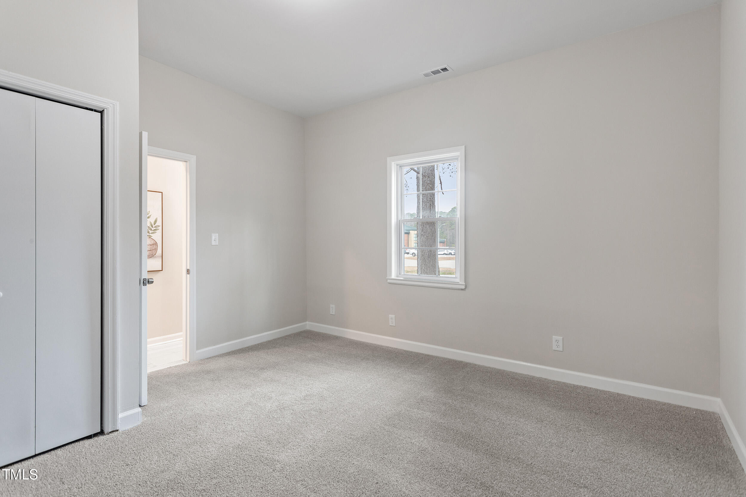 6215 Pine Street Bailey, NC 27807 - Photo 14 of 24 a view of an empty room with a window