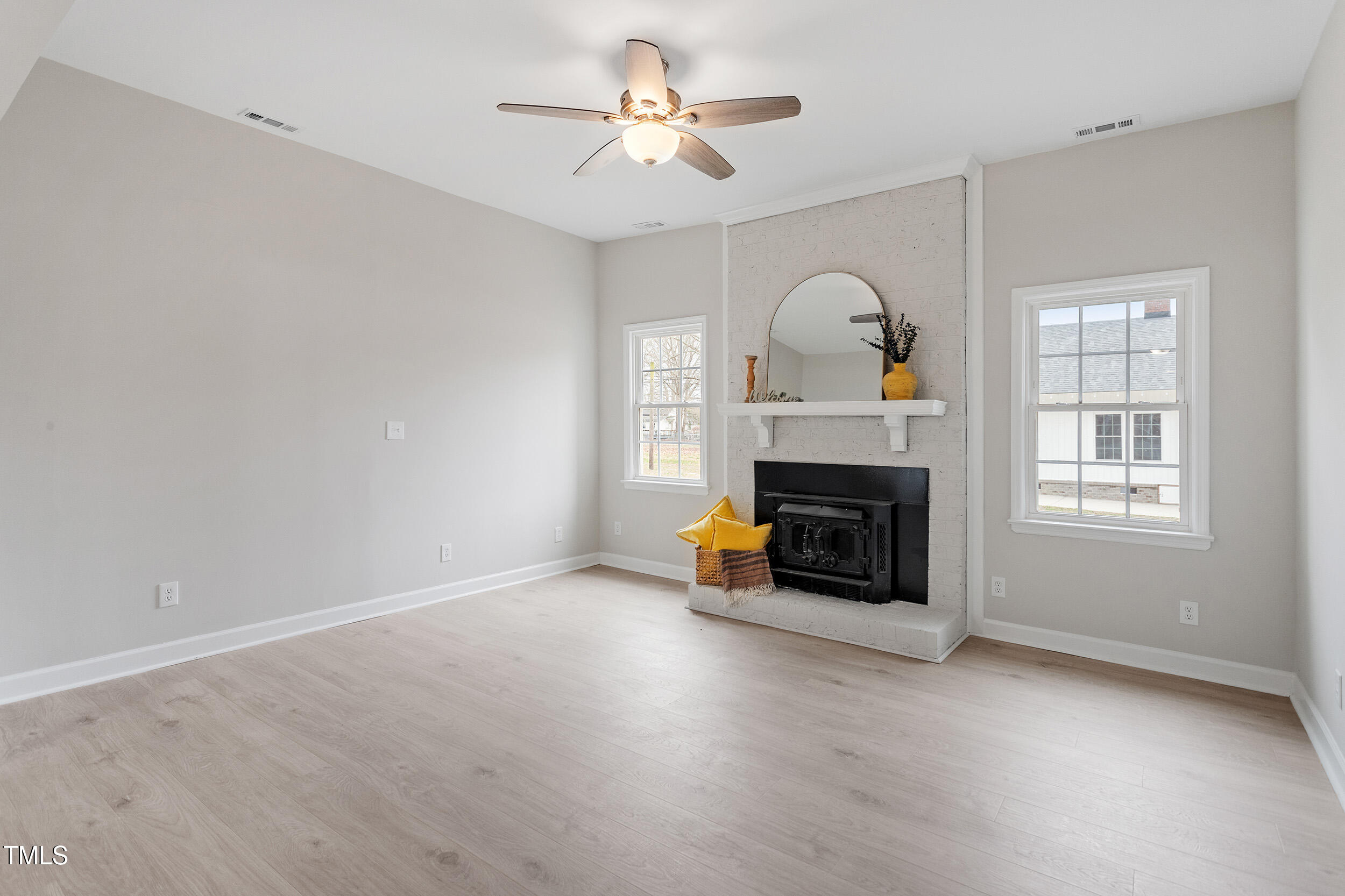 6215 Pine Street Bailey, NC 27807 - Photo 2 of 24 a living room with furniture and a fireplace