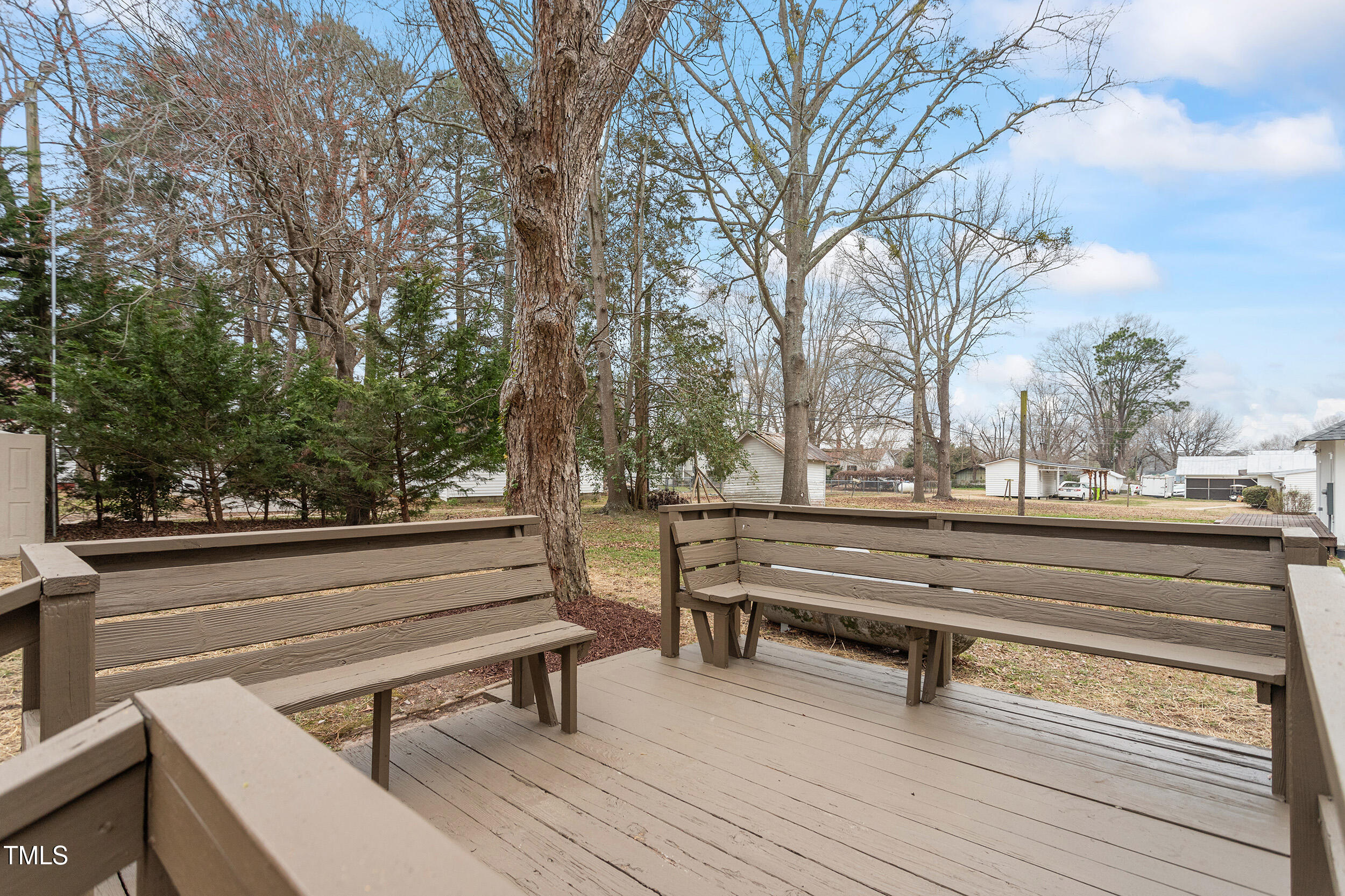 6215 Pine Street Bailey, NC 27807 - Photo 22 of 24 a view of bench and trees in a roof