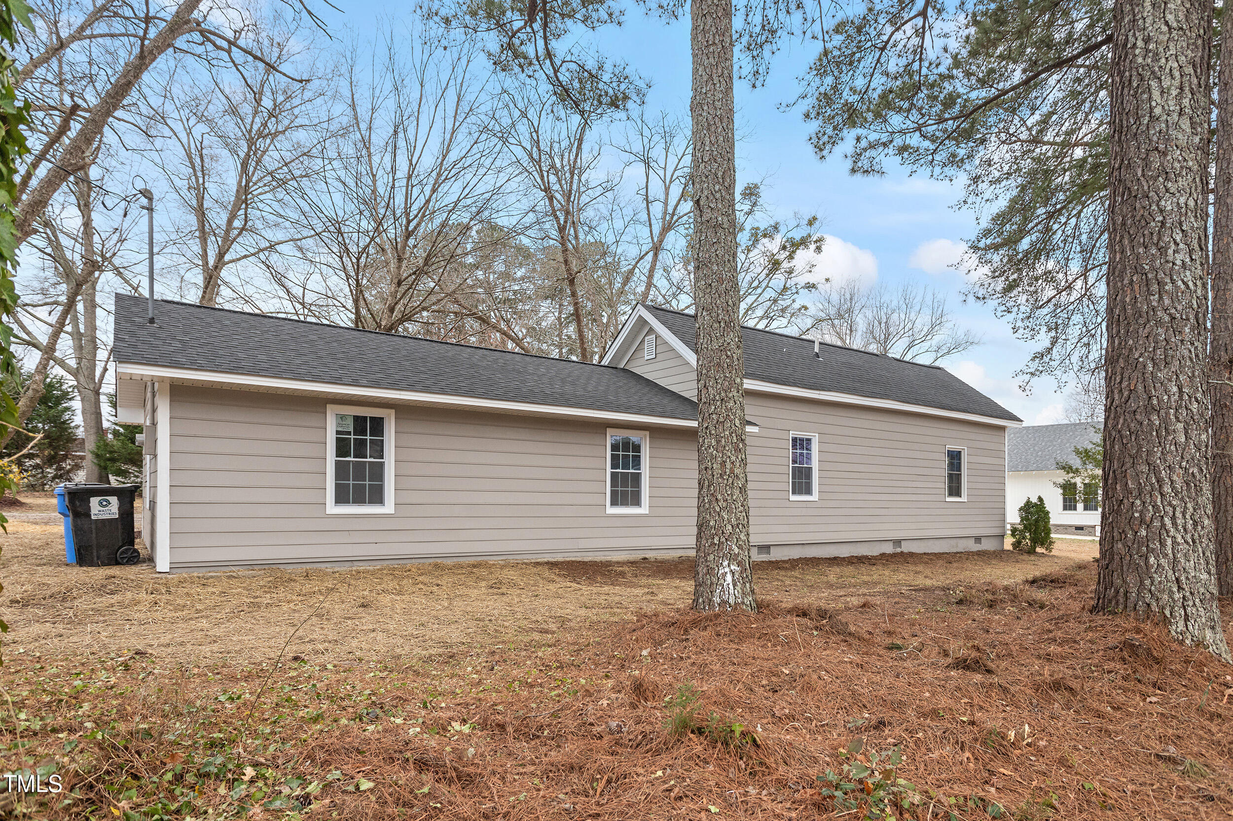 6215 Pine Street Bailey, NC 27807 - Photo 24 of 24 a house with trees in the background
