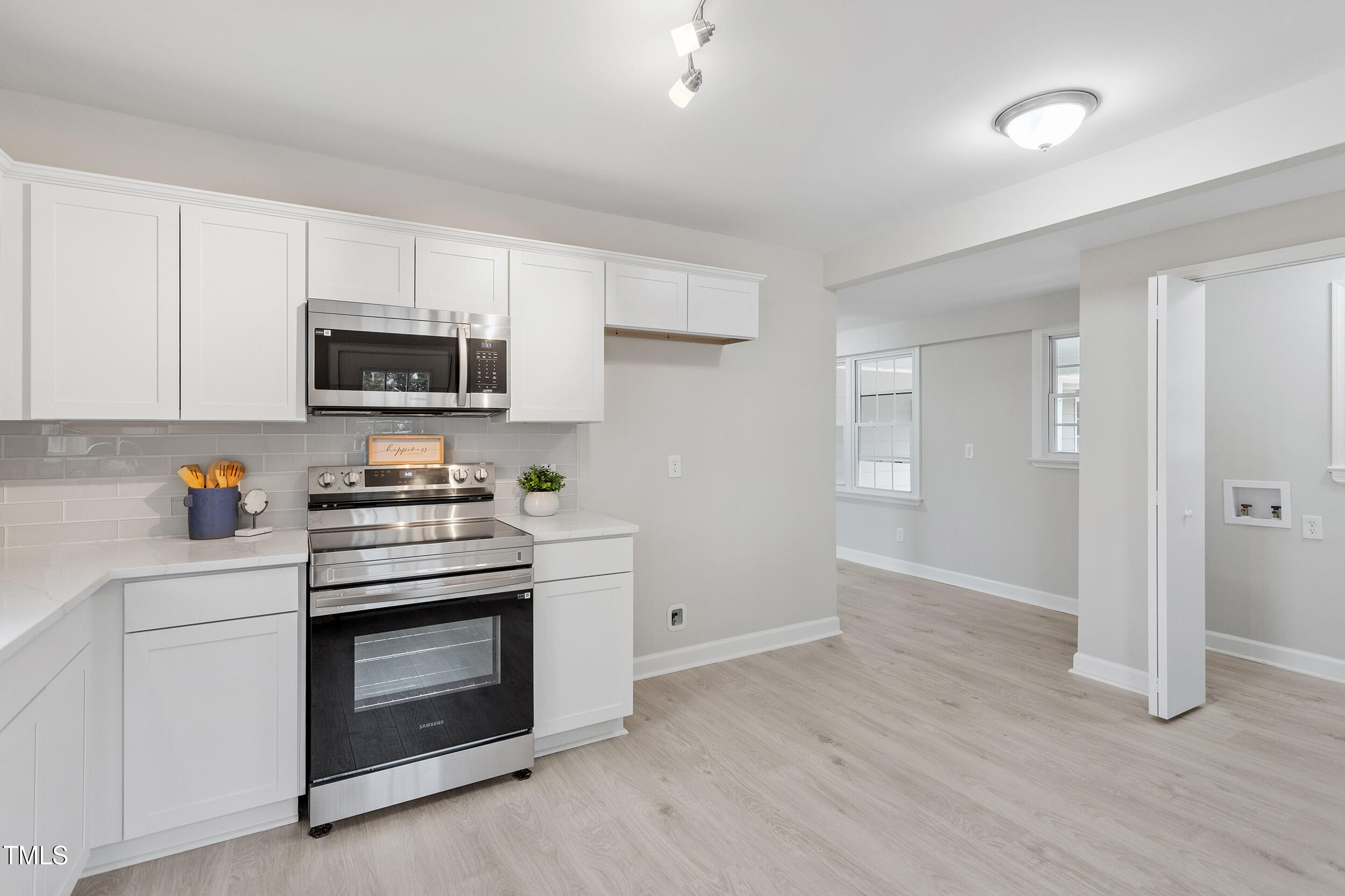 6215 Pine Street Bailey, NC 27807 - Photo 8 of 24 a kitchen with a stove and a microwave