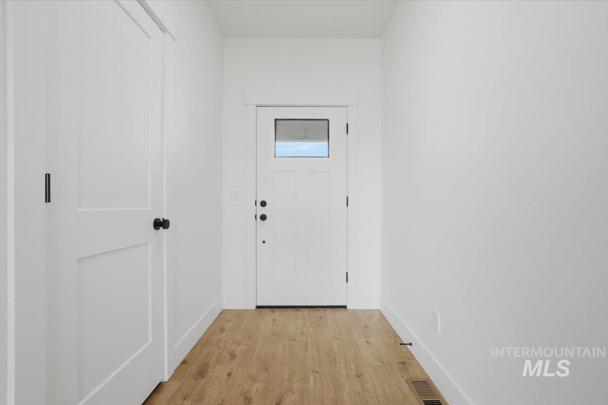 2175 Austin Way Fruitland, ID 83619 - Photo 5 of 30 Entryway with wood finished floors and baseboards