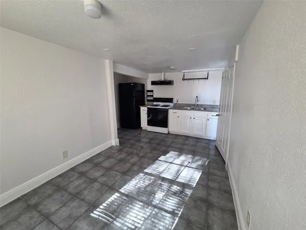 a large kitchen with cabinets