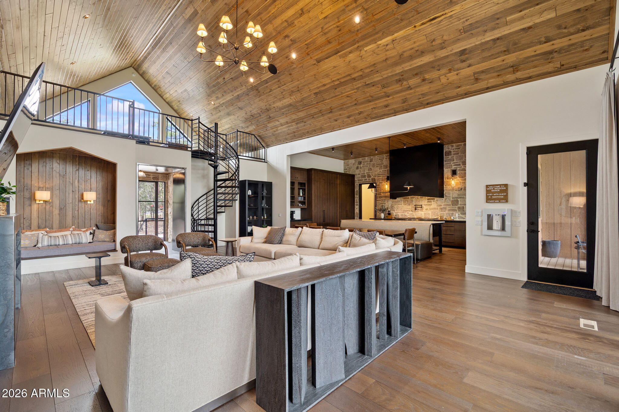 2441 South Monkshood Road Show Low, AZ 85901 - Photo 15 of 90 a view of a dining room with furniture wooden floor and chandelier
