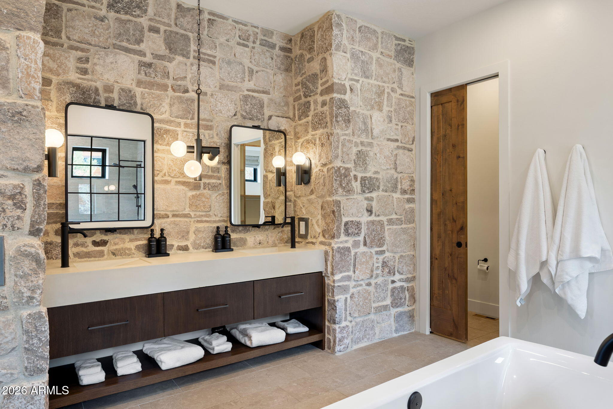 2441 South Monkshood Road Show Low, AZ 85901 - Photo 30 of 90 a bathroom with a double vanity sink a mirror and bathtub